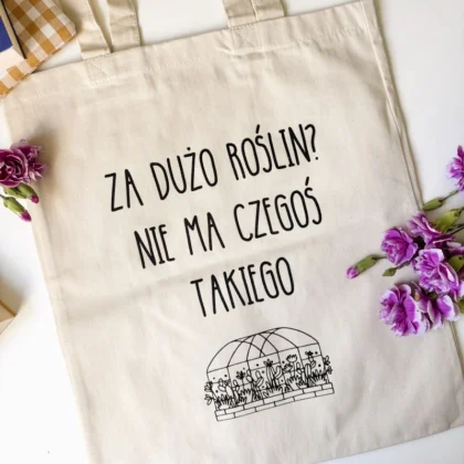Torba bawełniana Za dużo roślin, ułożona na stole wśród kwiatów